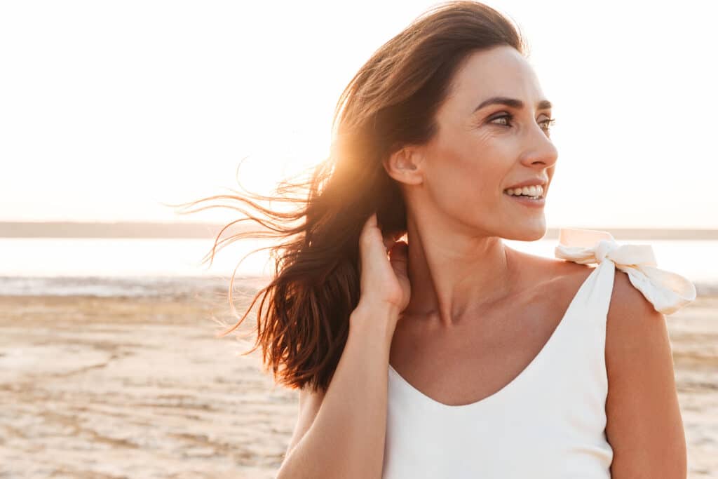 Close,Up,Of,A,Beautiful,Smiling,Young,Woman,Wearing,Summer shutterstock 1526200169
